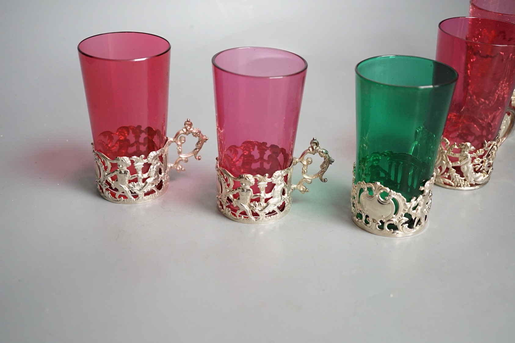 Five silver mounted glass tea holders - 9.5cm tall